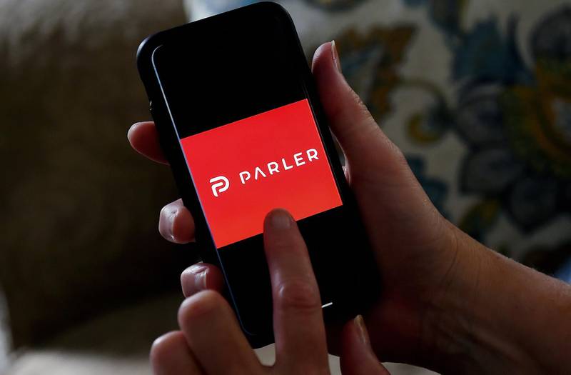(FILES) This illustration file photo taken on July 2, 2020 shows social media application logo Parler displayed on a smartphone in Arlington, Virginia.  Google said on January 8, 2021 that it had pulled the Parler app from its mobile store for allowing "egregious content" that could incite deadly violence like that seen at the US Capitol. / AFP / Olivier DOULIERY / TO GO WITH AFP STORY by Glenn Chapman "With social media in tumult, startup Parler draws conservatives"
