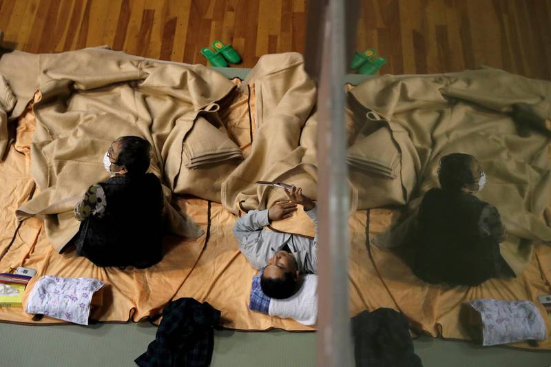 People rest in the evacuation centre for affected by the flood after Typhoon Hagibis in Nagano, Nagano Prefecture, Japan. REUTERS