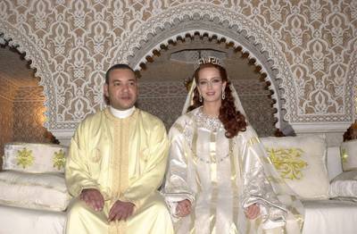 RABAT, MOROCCO - JULY 13:  King Mohamed VI of Morocco sits with his wife Princess Lalla Salma at the royal palace July 13, 2002 in Rabat, Morocco. Public celebrations for the Moroccan king's marriage took place, which broke a tradition of keeping royal wives hidden.  (Photo courtesy Moroccan Government/Getty Images)