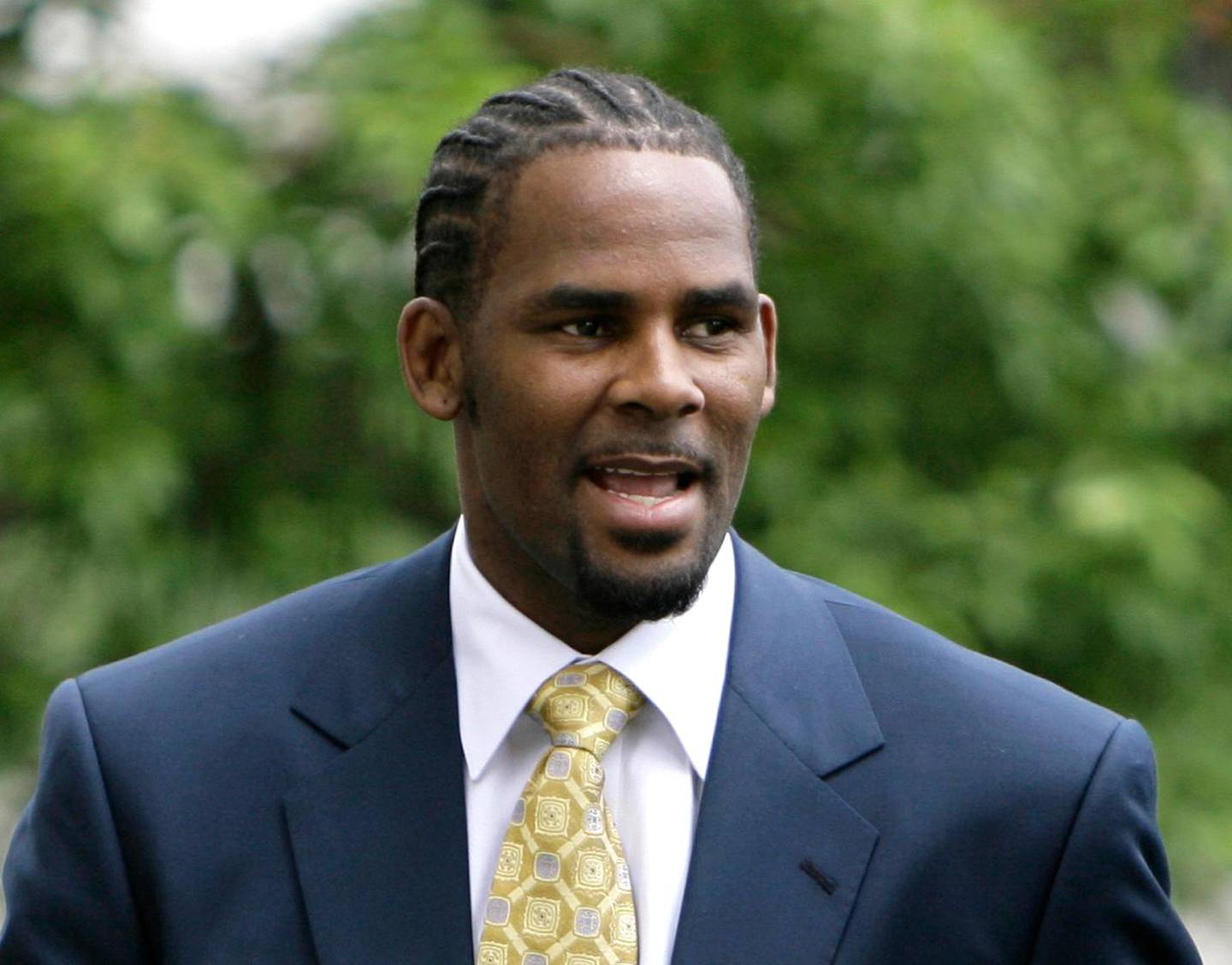 FILE - This June 13, 2008 file photo shows R&B singer R. Kelly arriving at 3the Cook County Criminal Court Building in Chicago. Kelly, one of the top-selling recording artists of all time, has been hounded for years by allegations of sexual misconduct involving women and underage girls _ accusations he and his attorneys have long denied. But an Illinois prosecutorâ€™s plea for potential victims and witnesses to come forward has sparked hope among some advocates that the R&B star might face new charges. (AP Photo/M. Spencer Green, File)