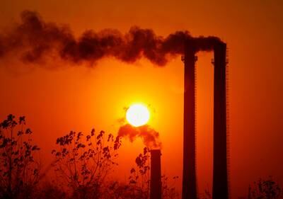 Smoke spews from oil refinery chimneys in Nanjing, China. Reuters