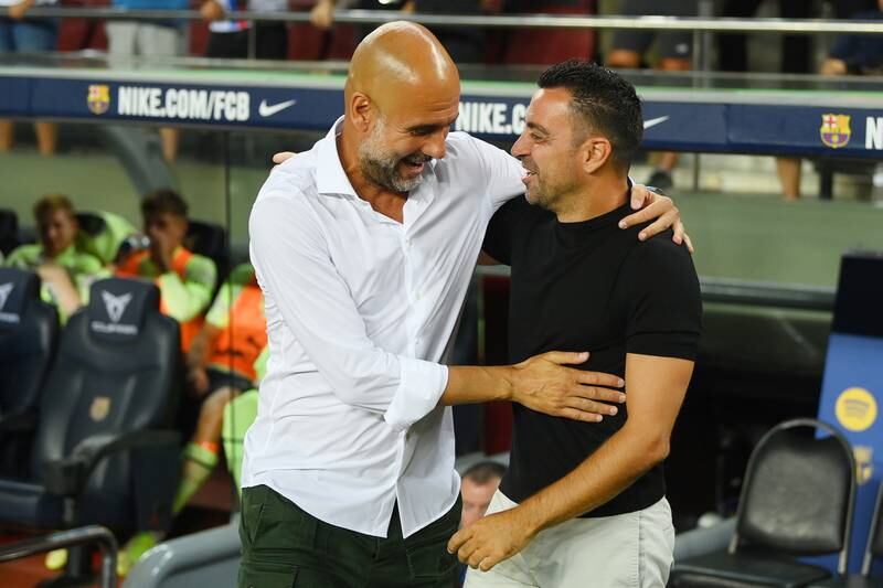 BARCELONA, SPAIN - AUGUST 24: Pep Guardiola, Manager of Manchester City and Xavi, Head coach of FC Barcelona embrace prior to the friendly match between FC Barcelona and Manchester City at Camp Nou on August 24, 2022 in Barcelona, Spain. (Photo by David Ramos / Getty Images)