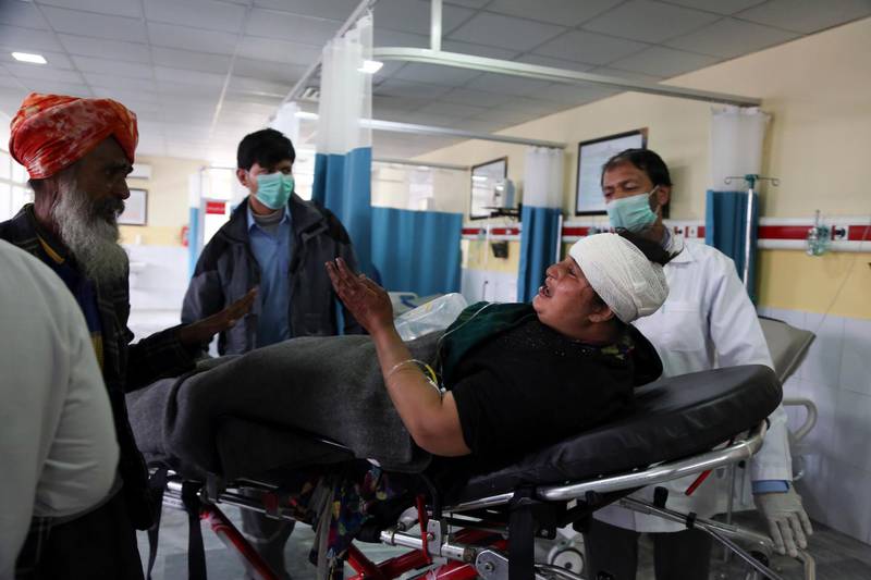 An Afghan Sikh woman wounded in a gunmen attack is brought to a hospital in Kabul, Afghanistan. AP Photo