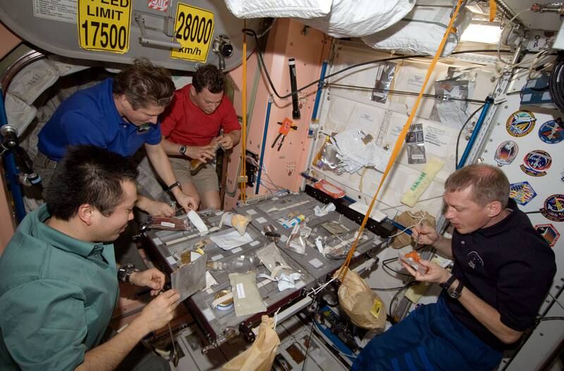 Expedition 20 crew members share a meal in the Unity node of the International Space Station in June 2009. Photo: Nasa