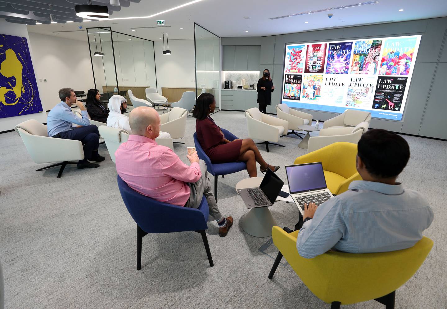 The large collaboration area between the two floors of the DIFC building that law firm Al Tamimi & Company occupies houses a digital communication screen and break-out pods. This area creates an inspiring environment for staff. Photo: Chris Whiteoak / The National