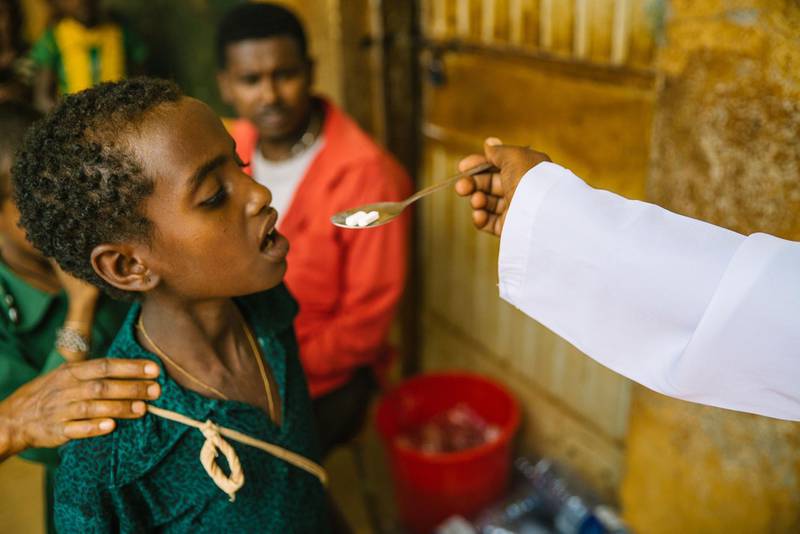 A child takes part in a de-worming program run by The End Fund, an NTD charity, in Ethiopia. Courtesy The End Fund