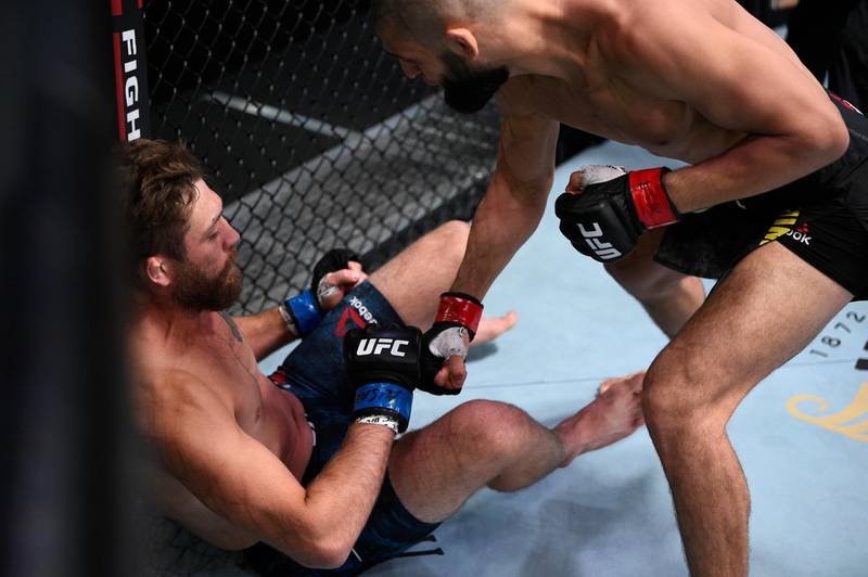 LAS VEGAS, NEVADA - SEPTEMBER 19: (R-L) Khamzat Chimaev of Chechnya punches Gerald Meerschaert in their middleweight bout during the UFC Fight Night event at UFC APEX on September 19, 2020 in Las Vegas, Nevada. (Photo by Chris Unger/Zuffa LLC)