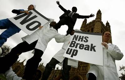Unison members protest in front of the British Parliament to protest against conditions which will turn the NHS into a two-tier system in 2003. Getty Images