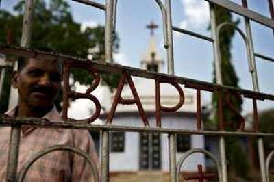 Dusashan Digal, 55, as caretaker of the Baptist Church in Phulbani, has been making repairs to the church since a mob attempted to demolish the structure during riots last year. *** Local Caption ***  hsanna 27.08.09 thenational orissa christians 06.jpg