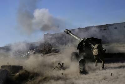 A member of the Ukrainian Volunteer Corps fires a howitzer in Ukraine's Zaporizhzhia region last month. Reuters