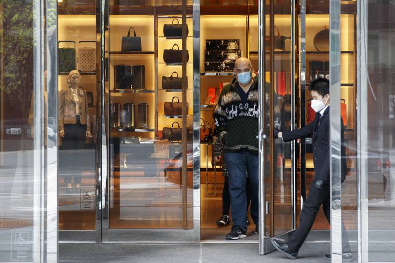 Shoppers leave a Louis Vuitton store in Toronto, Ontario, Canada. Bloomberg