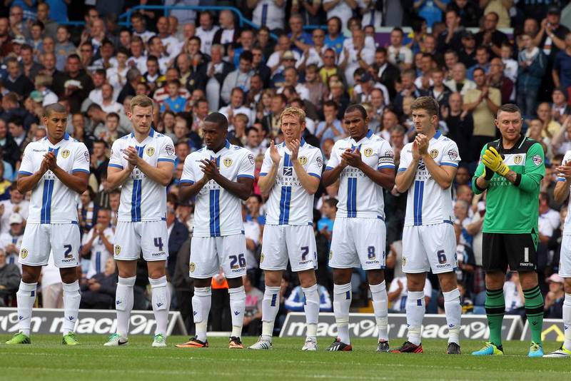 Players applaud fans who have passed away in the last 12 months during the Sky Bet Championship match between Leeds United and Sheffield at Elland Road on August 17, 2013 in Leeds, England. Tim Keeton/Getty Images