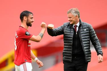 Manchester United manager Ole Gunnar Solskjaer congratulates Portuguese midfielder Bruno Fernandes, one of the best signings of the season. AFP