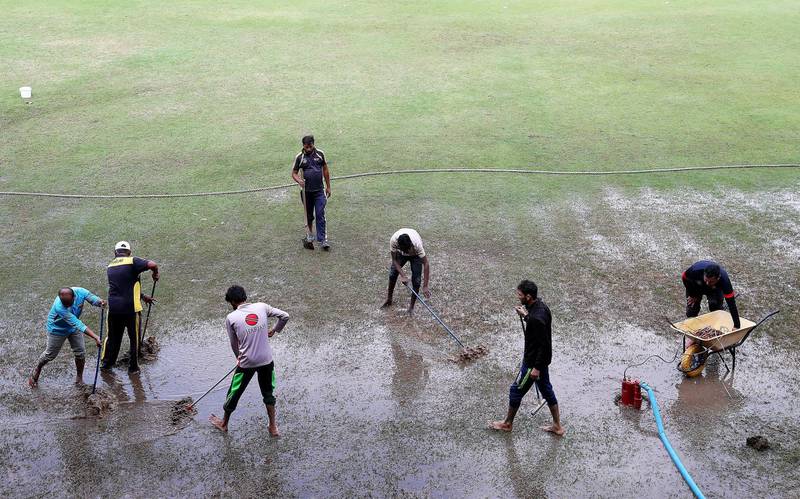 SHARJAH, UNITED ARAB EMIRATES , Dec 11– 2019 :- Ground staff clearing  the rain water from the cricket ground at the Sharjah Cricket Stadium in Sharjah. World Cup League 2 match between UAE vs Scotland abandoned due to wet ground. ( Pawan Singh / The National )  For News/Sports/Instagram/Online. Story by Paul
