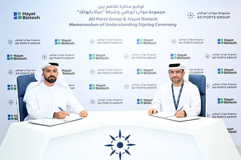 Capt Mohamed Al Shamisi, managing director and group chief executive of AD Ports Group, right, and Naser Al Yammahi, deputy chief executive of Hayat Biotech sign the agreement. Photo: AD Ports Group