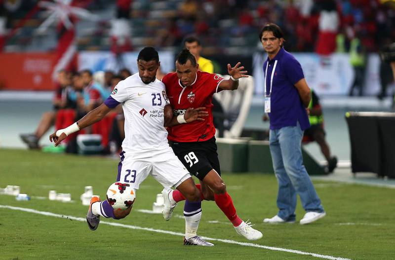 Ciel, right, of Al Ahli and Mohamed Ahmad, left, of Al Ain in action during the President's Cup final on Sunday. Pawan Singh / The National / May 18, 2014