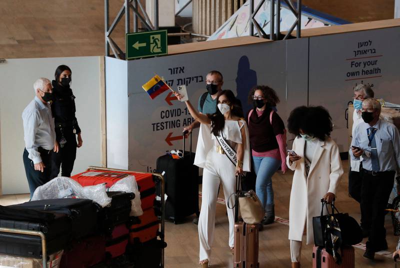 Miss Universe contestants arrive at Israel's Ben Gurion Airport in Lod, east of Tel Aviv, on November 28, 2021. AFP