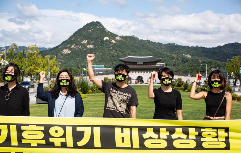 Members of an environmental group in Seoul, South Korea, take part in a protest against climate change. EPA