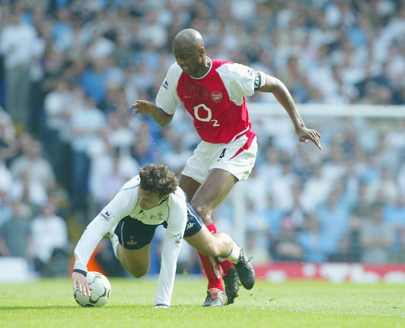 LONDON - APRIL 25: Patrick Vieira of Arsenal clashes with Mauricio Tarricco of Spurs during the FA Barclaycard Premiership match between Tottenham Hotspur and Arsenal at White Hart Lane on April 25, 2004 in London.  (Photo by Ben Radford/Getty Images)