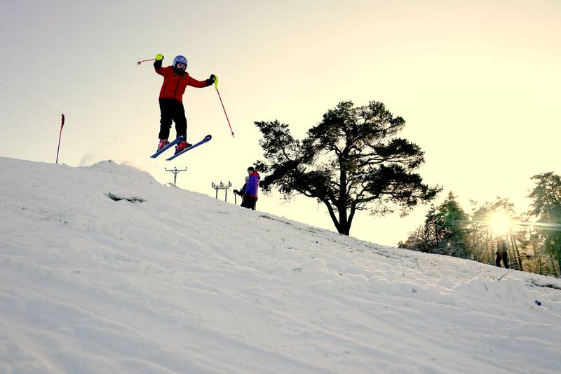 A skier was pictured jumping on the slopes at Allenheads in the Pennines in Northumberland on Wednesday. PA