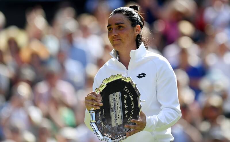 Tunisia's Ons Jabeur poses with her runner-up trophy after the women's final at the Wimbledon tennis championships on Saturday. EPA