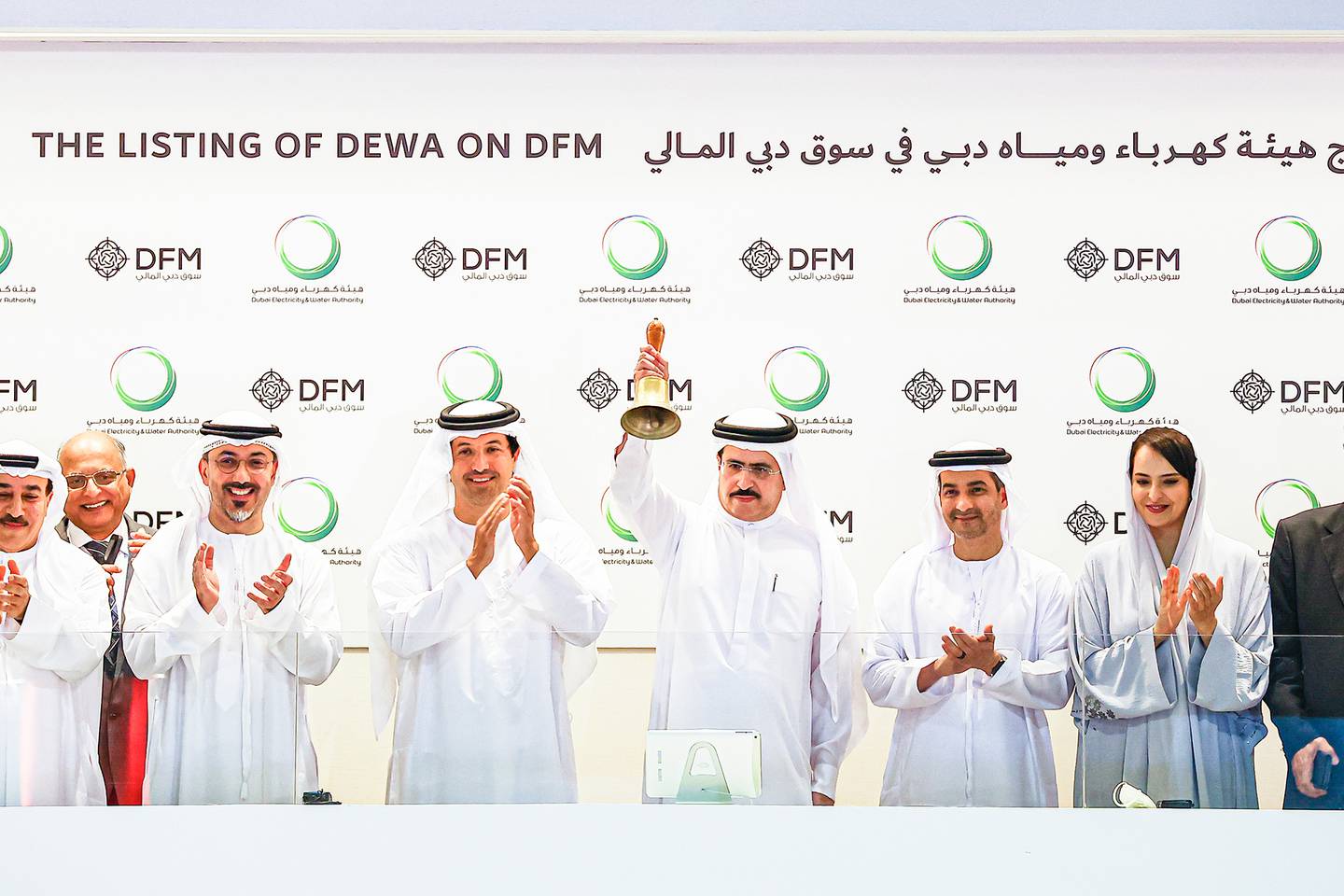 Saeed Mohammed Al Tayer, managing director and chief executive of Dewa, and other officials during the utility's debut on the DFM on April 12. Photo: Dewa