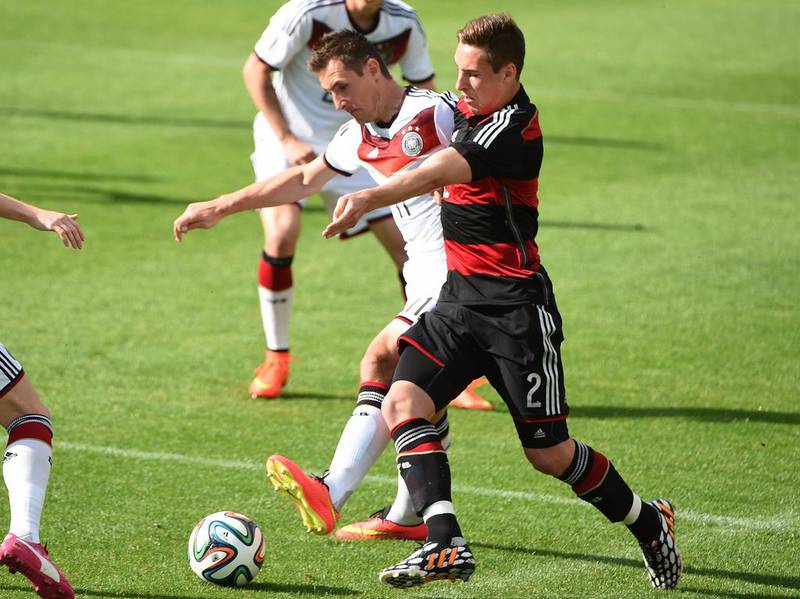 Germany's Miroslav Klose, left, and U-20 midfielder Dominik Kohr vie for the ball during their training game on Sunday. Patrik Stollarz / AFP