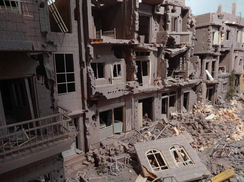 A depiction of a ruined Syrian neighbourhood.