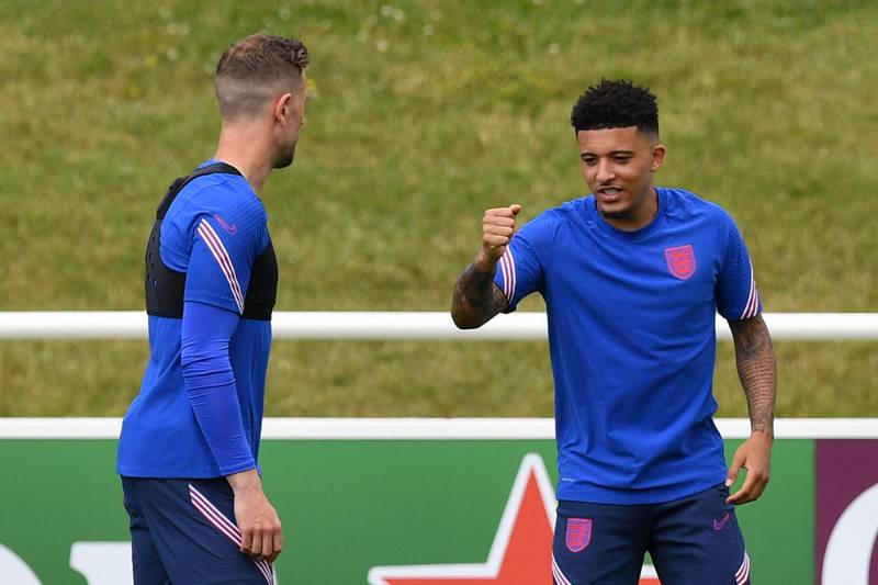 Jadon Sancho and Jordan Henderson during a training session at St George’s Park ahead of the Euro 2020 match against Croatia.