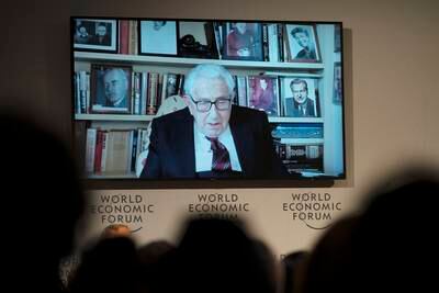 Former US secretary of state Henry Kissinger appears on screen during the annual meeting of the World Economic Forum, in Davos. AP