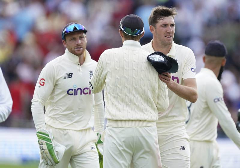 England's Craig Overton, right, celebrates with teammates after the last wicket of India's Mohammad Siraj in Leeds. AP