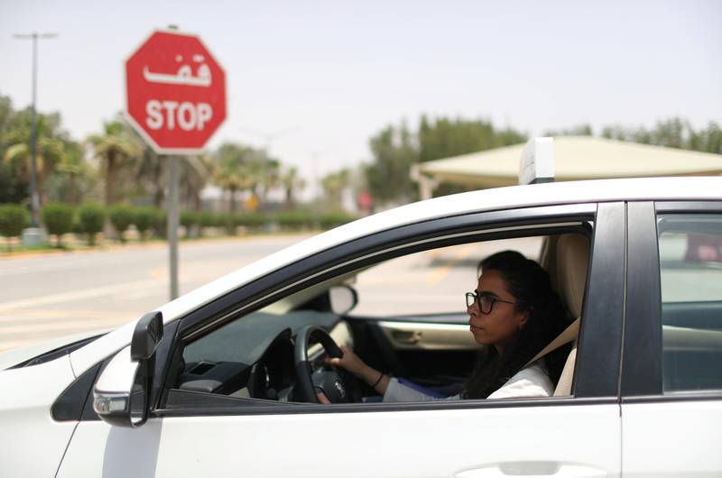 Learner-driver Maria Al Faraj stops the car at a junction. Ahmed Jadallah / Reuters