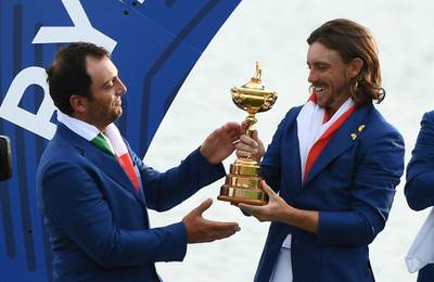 Europe's English golfer Tommy Fleetwood (R) Italian golfer Francesco Molinari hold the trophy as they celebrate winning  the 42nd Ryder Cup at Le Golf National Course at Saint-Quentin-en-Yvelines, south-west of Paris, on September 30, 2018.  / AFP / FRANCK FIFE

