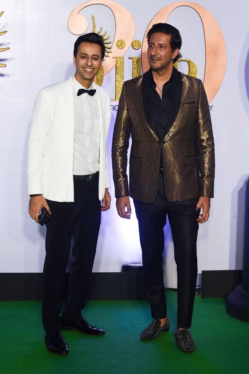 Bollywood music directors and singers Salim (L) and Sulaiman Merchant arrive for the IIFA Rocks of the 20th International Indian Film Academy (IIFA) Awards at NSCI Dome in Mumbai on September 16, 2019