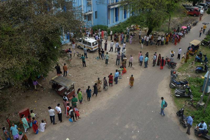 People queue for the coronavirus vaccine at the North Bengal Medical College and Hospital on the outskirts of Siliguri. AFP