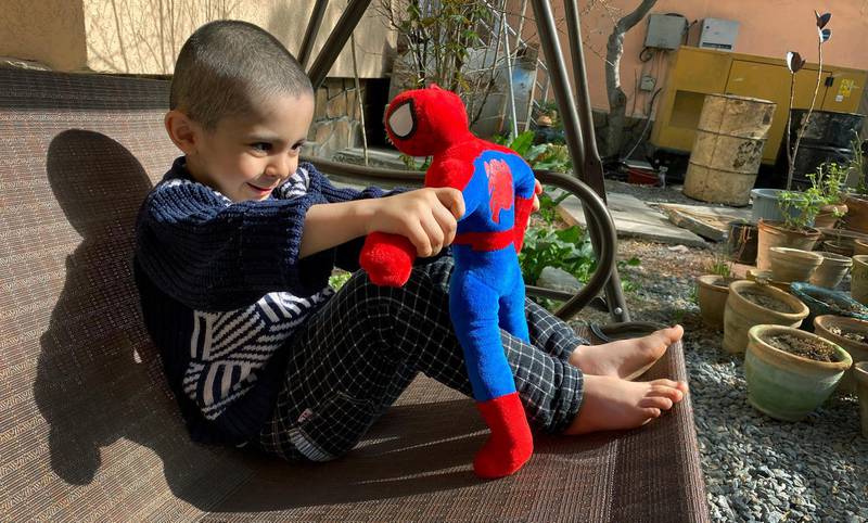 Afghan four-year old Ahmad Yosuf plays with a Spiderman toy in the yard of his house as kindergartens continue to be closed due to the fear of coronavirus outbreak in Kabul, Afghanistan.  EPA