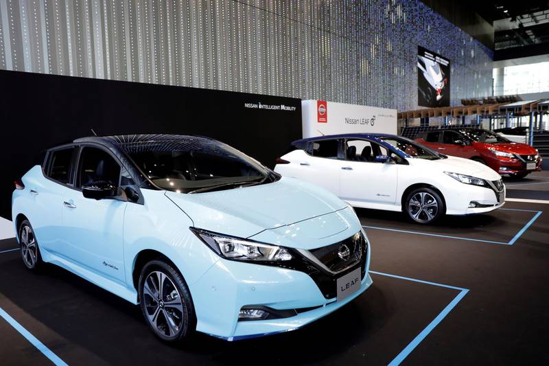 Nissan Motor Co. Leaf e+ electric vehicles (EV) stand on display in a showroom at the company's global headquarters in Yokohama, Japan, on Wednesday, Jan. 9, 2019. Nissan unveiled a new version of its Leaf electric car after delaying its launch amid the shock arrest of former chairman Carlos Ghosn. The new model, launched Tuesday in Las Vegas, narrows the driving-range gap versus Tesla Inc.’s Model 3 and General Motors Co.’s Chevrolet Bolt. Photographer: Kiyoshi Ota/Bloomberg