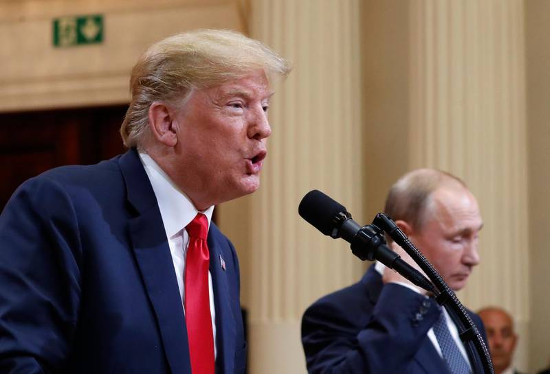 U.S. President Donald Trump speaks with Russian President Vladimir Putin during a press conference after their meeting at the Presidential Palace in Helsinki, Finland, Monday, July 16, 2018. (AP Photo/Pablo Martinez Monsivais)