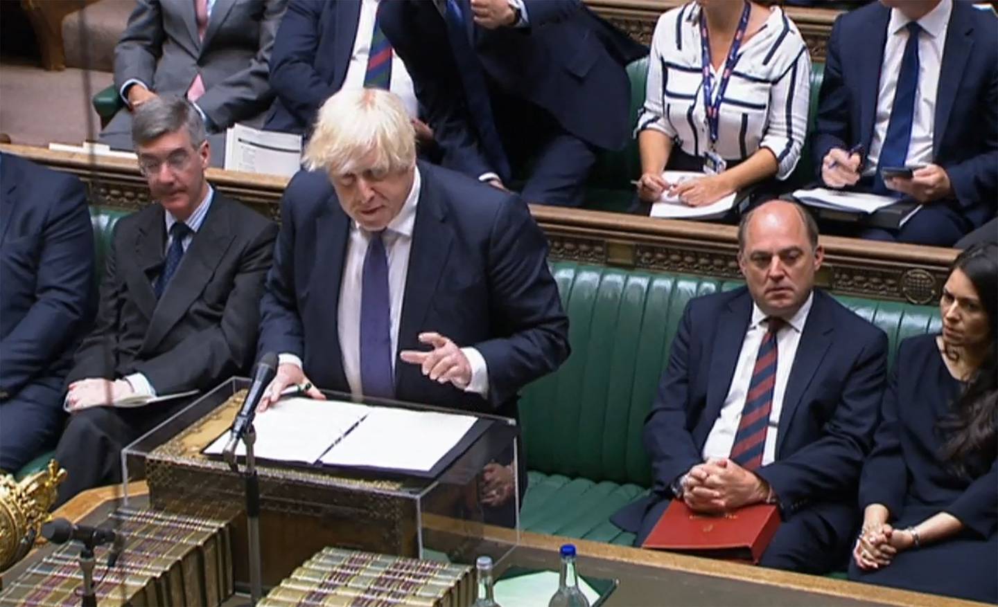 UK Prime Minister Boris Johnson addresses parliament during an extraordinary session to discuss the collapse of the Afghan government. AFP