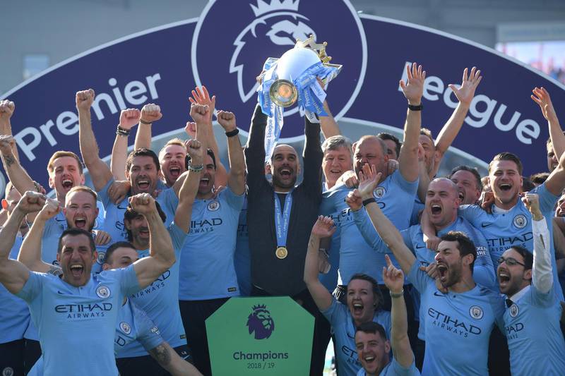 BRIGHTON, ENGLAND - MAY 12: Josep Guardiola,Manager of Manchester City lifts the Premier League Trophy after winning the title during the Premier League match between Brighton & Hove Albion and Manchester City at American Express Community Stadium on May 12, 2019 in Brighton, United Kingdom. (Photo by Mike Hewitt/Getty Images)