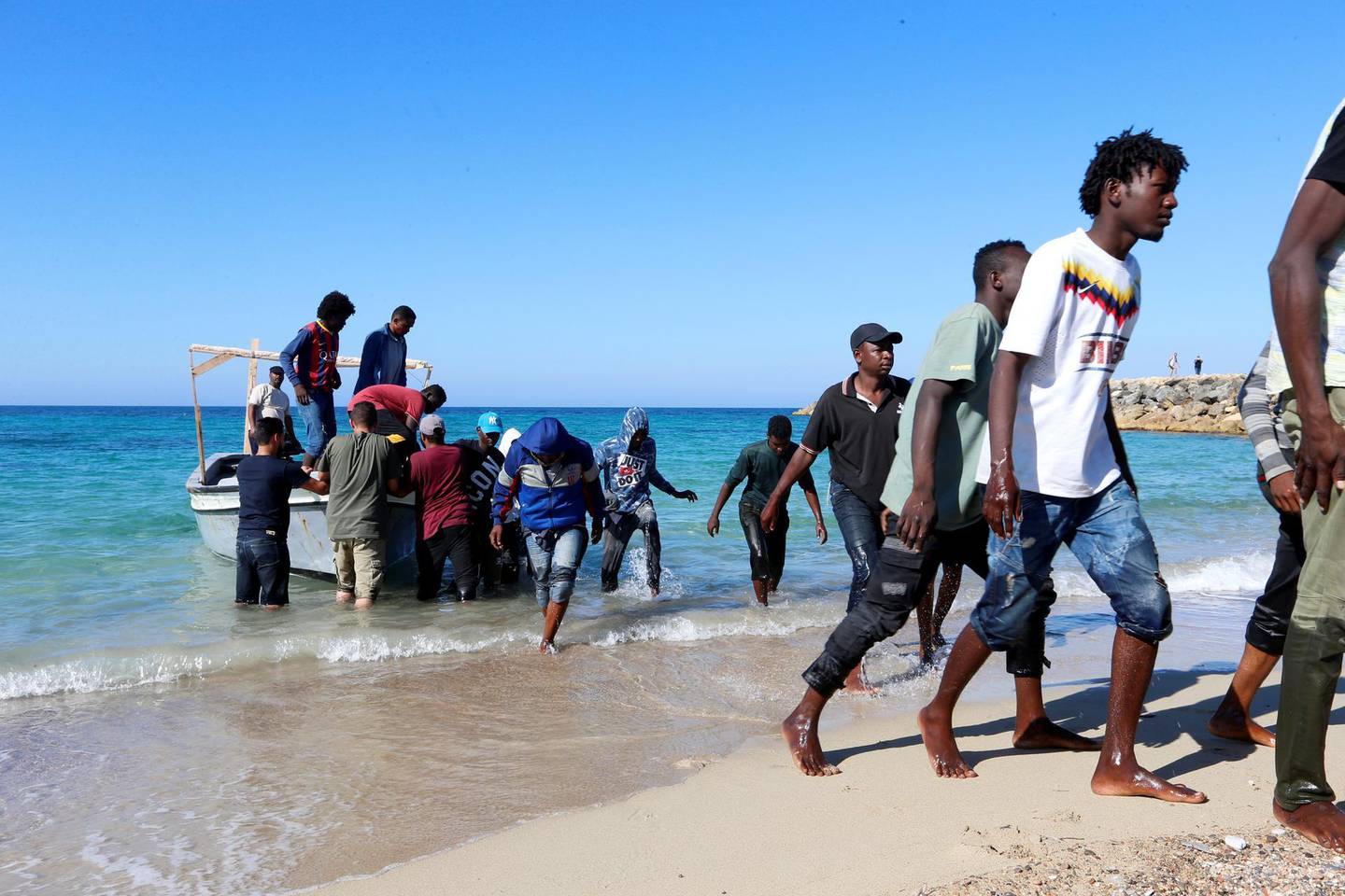 Migrants are seen after being rescued by Libyan coast guard in Tripoli, Libya July 26, 2019. REUTERS/Ismail Zitouny