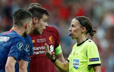 Referee Stephanie Frappart shows a yellow card to Chelsea's Cesar Azpilicueta. AP Photo