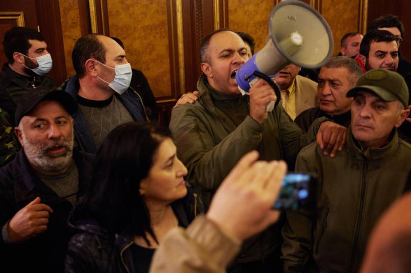 Protestors storm Armenian Prime Minister Nikol Pashinian's office after the announcement of a peace deal in the war between Armenia and Azerbaijan in Yerevan. Getty Images