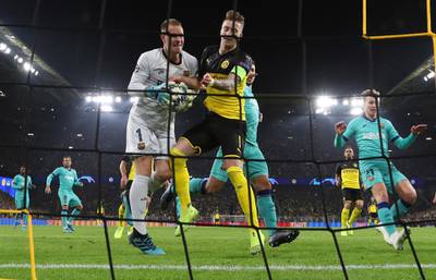 Dortmund's Marco Reus collides with Barcelona's goalkeeper Marc-Andre ter Stegen. EPA