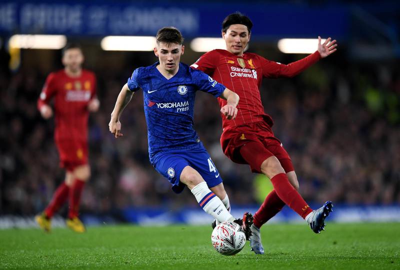 Billy Gilmour begins to bribble the ball away from Takumi Minamino. Getty Images
