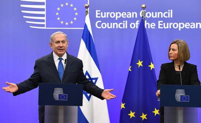 Israel's Prime Minister Benjamin Netanyahu and EU foreign policy chief, Federica Mogherini speak during a joint press conference at the European Council in Brussels on December 11, 2017. 
Israeli Prime Minister Benjamin Netanyahu is ?holding talks on December 11 with EU foreign ministers, days after the US decision to recognise Jerusalem as Israel's capital, a move the premier had long sought but which has been met by widespread condemnation. / AFP PHOTO / EMMANUEL DUNAND