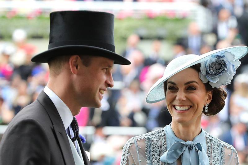 Prince William, Duke of Cambridge and Catherine, Duchess of Cambridge share a joke at the horse race. Getty Images