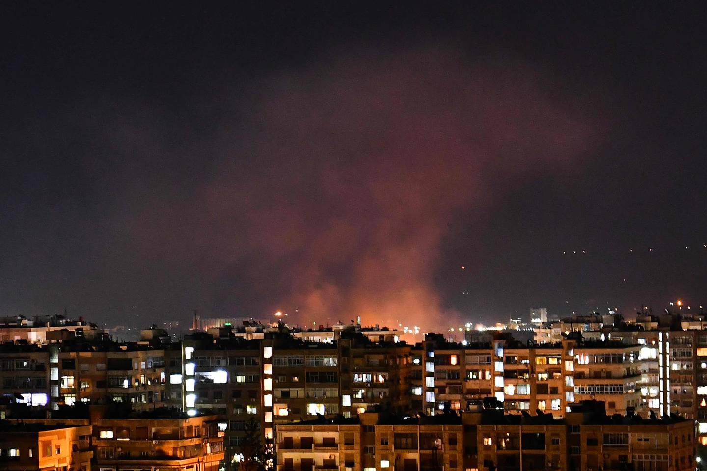 Smoke billows following an Israeli airstrike targeting south of the capital Damascus, on July 20, 2020. Israeli strikes south of the Syrian capital wounded seven Syrian soldiers, state media reported, in an attack which a war monitor said hit several positions of regime forces and Iran-backed militias. / AFP / STR
