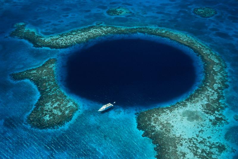 Great Blue Hole lies about 40 miles off the coast of Belize. Getty