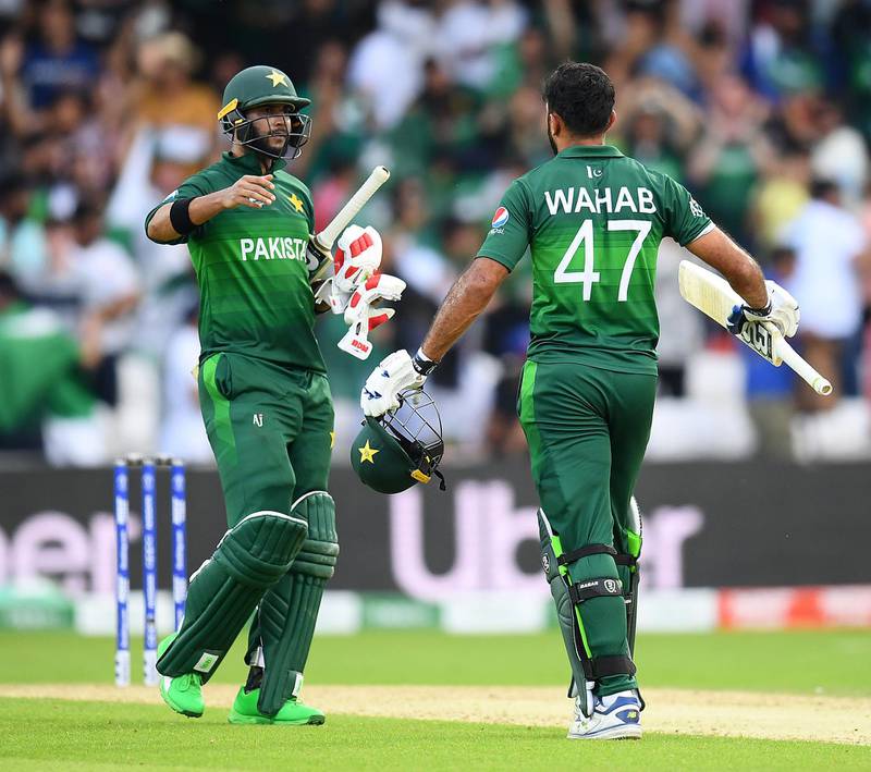LEEDS, ENGLAND - JUNE 29: Wahab Riaz and  Imad Wasim of Pakistan celebrate the win after the Group Stage match of the ICC Cricket World Cup 2019 between Pakistan and Afghanistan at Headingley on June 29, 2019 in Leeds, England. (Photo by Clive Mason/Getty Images)